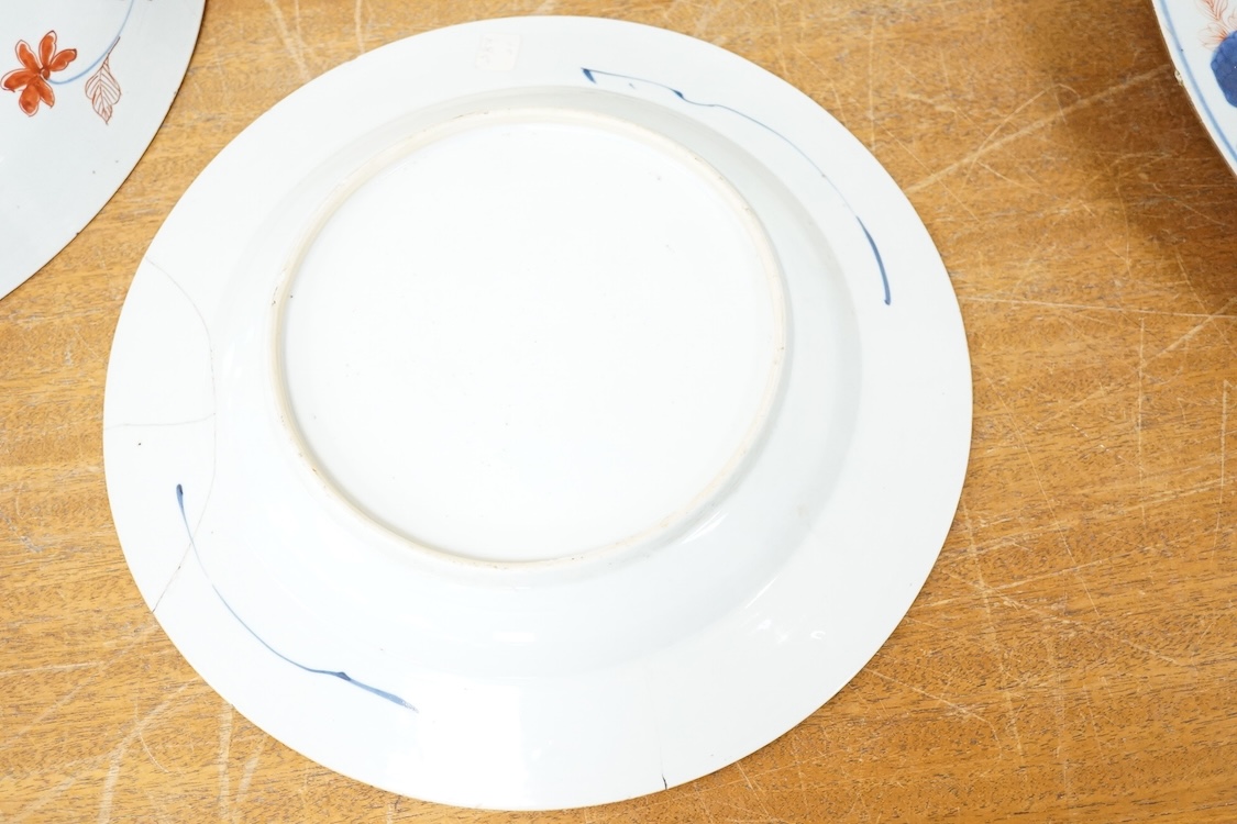 Three early 18th century Chinese Imari dishes (one clobbered), largest 46.5cm, together with a 19th century Chinese powder blue ground vase, 44cm high and a horn carving, 13.7cm (5)